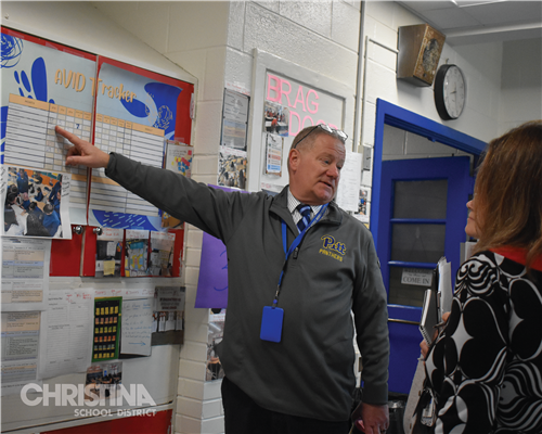 Photo of AVID instructor speaking with teachers